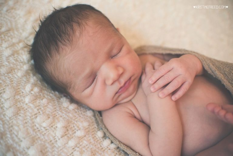 newborn photo shoot, wrapped bean bag posing, Kristine Freed Photography