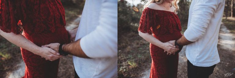 holding pregnant belly