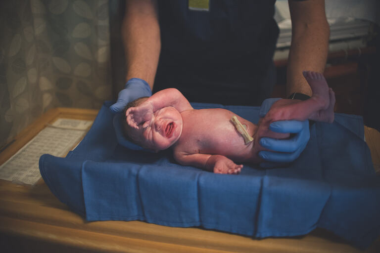 new baby getting weighed, Tampa birth photographer makes a list of questions to ask your doctor about birth